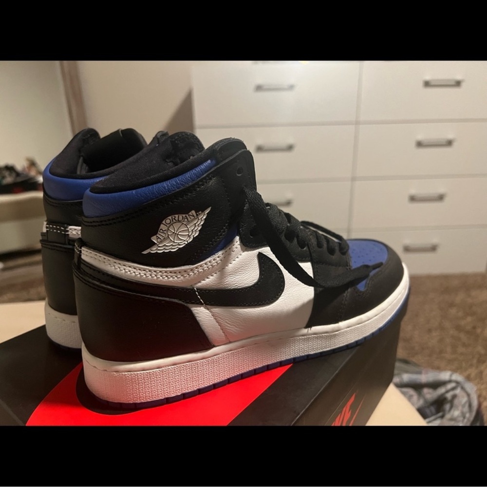 Nike Air Jordan High Tops in Black, White, and Blue